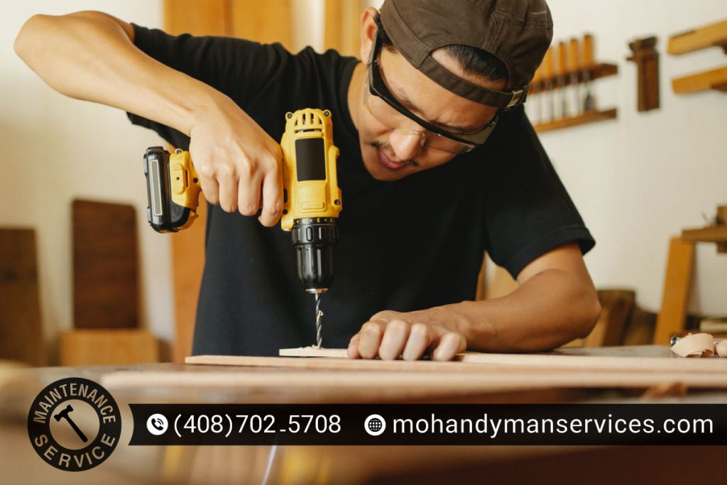Professional handyman in Mountain View repairing kitchen cabinets with reliable tools and expertise.